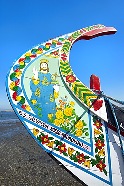 Colorful hand painted prow of a gondola-like moliceiro on the beach, Torreira, Aveiro, Beira, Portugal, Europe