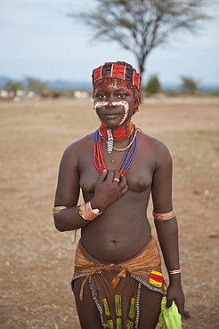 Young Hamar woman with facial paintings, colorful necklaces and head adornment, Omo River Valley, Ethiopia, Africa