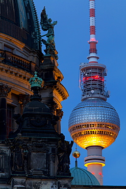 Close-up of the Berliner Dom (Cathedral) with the Television Tower in the background at night, Berlin, Germany, Europe 