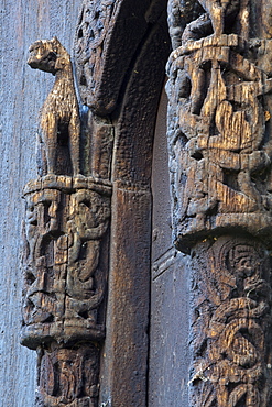 Detail of carved portal arch, Lom Stave Church, Oppland, Gudbrandsdal, Norway, Scandinavia, Europe 