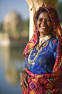 Portrait of a mid adult woman in traditional dress, Jaisalmer, Rajasthan, India, Asia