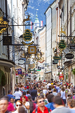 Ornate shop signs on Getreidegasse, Salzburgs bustling shopping street, Salzburg, Salzburger Land, Austria, Europe