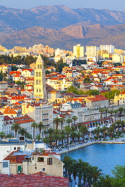 Elevated view over Split's picturesque Stari Grad and harbour illuminated at sunset, Split, Dalmatia, Croatia, Europe