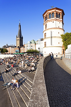 People on stairs by the Rhine, Lambertus Church and Schlossturm tower, Dusseldorf, North Rhine Westphalia, Germany, Europe