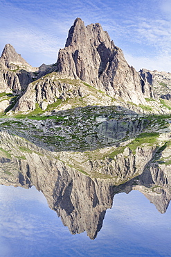 Pic Lombarduccio reflecting in Lac de Melo, Gorges de la Restonica, Haute Corse, Corsica, France, Mediterranean, Europe 