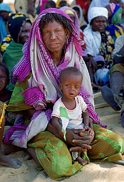 Woman sitting holding a child in Northern Nigeria