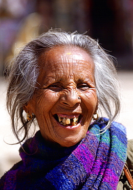 Local grey-haired woman laughing in Nepal