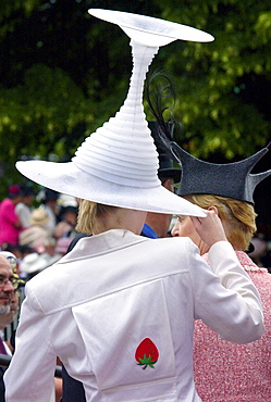 Race-goer wearing a hat like an upturned wine glass in true Ascot fashion at Ascot Races