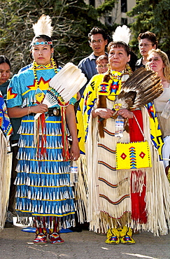 Cree Indian women, First Nation Canadian, in traditional costume with face painted at heritage display in Regina, Canada