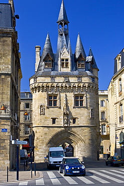 Mini Cooper car at Porte Cailhau 15th century entrance to city of Bordeaux marks victory of Charles VIII at Fornoue