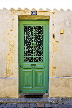 Traditional door with metal design, Ile De Re, France.