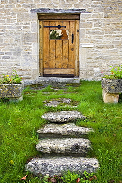 Wooden door of a house in the Cotswolds, Oxfordshire, United Kingdom