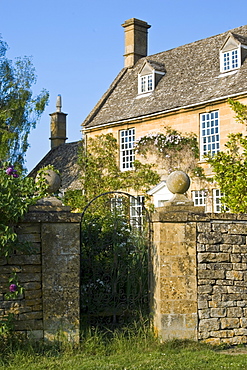 Grand house period property with dry stone wall near Winchcombe, Gloucestershire, The Cotswolds, England, United Kingdom