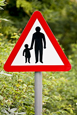 Pedestrians In Road Ahead warning sign by the road in Oxfordshire, United Kingdom