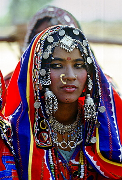 Young girl in national costume and jewels, Devara Yamzal, India.