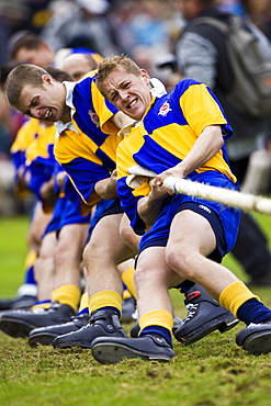 Men compete in Tug O' War contest at the Braemar Games Highland Gathering, Scotland, UK