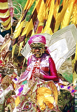 Dancers in ornate colourful national costumes at a carnival in Trinidad.