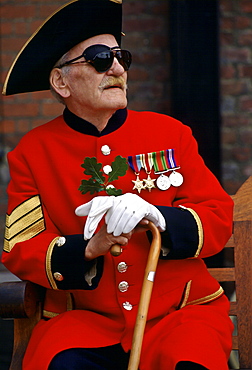 Chelsea Pensioner in red coat and tricorn hat on Founder's Day Parade at Royal Hospital, Chelsea, London, UK.