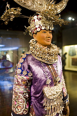 Chinese costume and Miao silver jewellery on display in the Shanghai Museum, China