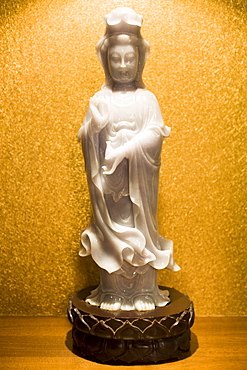 Lavender jade Goddess of Mercy figurine on display in the Huahui Jade Factory and Showroom, Xian, China