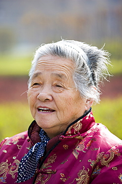 Elderly woman in the park by the City Wall, Xian, China