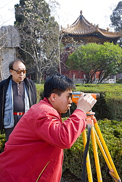 Surveyor at work at the Forest of Stone Tablets, Xian, China