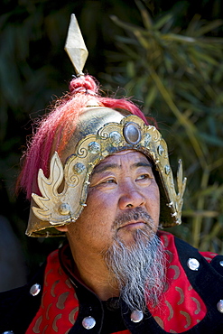 Man dressed in Mongolian Warrior costume at The Great Wall of China, Mutianyu, north of Beijing (formerly Peking)