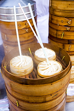 Soup dumplings with straws for sale in the Yu Garden Bazaar Market, Shanghai, China