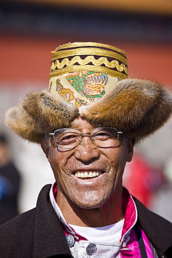 Man from Chinese minority group visits the Forbidden City, Beijing, China