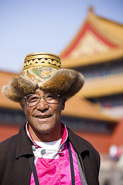 Man from Chinese minority group visits the Forbidden City, Beijing, China