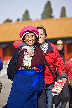 Women from Chinese minority group visit the Forbidden City, Beijing, China