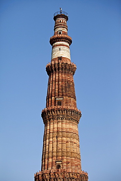 Qutub Minar minaret tower with verses from the Qur'an at Qutab Minar Complex, Unesco World Heritage Site in New Delhi, India