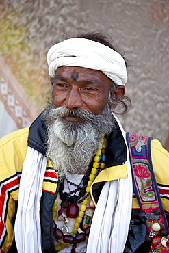 Hindu man pilgrim with beads and turban at Dashashwamedh Ghat in holy city of Varanasi, Benares, India