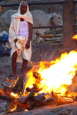 Body burning on funeral pyre at Hindu cremation at Manikarnika crematorium Ghat in Holy City of Varanasi, Benares, India