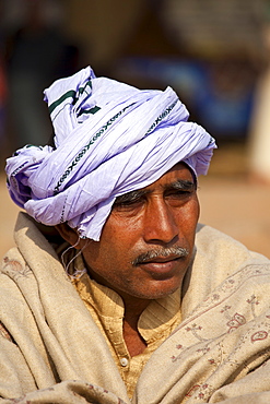 Hindu pilgrim with turban at Dashashwamedh Ghat in holy city of Varanasi, Benares, India