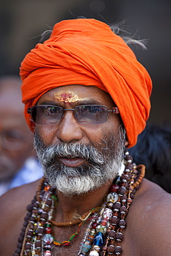 Hindu sadhu pilgrim with beads and turban in holy city of Varanasi, Benares, India