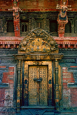 An ornate carved and decorated doorway of a building in Patan - a city famous for such decorative buildings.