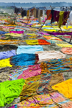 Saris and other laundry drying on the banks of River Yamuna at Agra, India