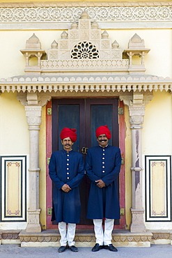 Palace guards in achkan suit at former Royal Guest House now a textile museum in the Maharaja's Moon Palace in Jaipur, Rajasthan, India