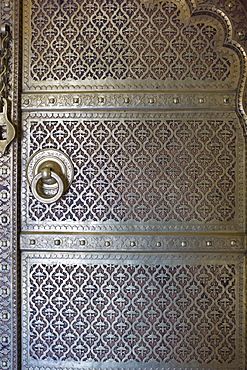 Brass panelling of door to the harem Zenana Deorhi at The Maharaja of Jaipur's Moon Palace in Jaipur, Rajasthan, India