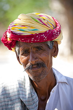 Indian man wears traditional Rajasthani turban in Jaipur, Rajasthan, Northern India