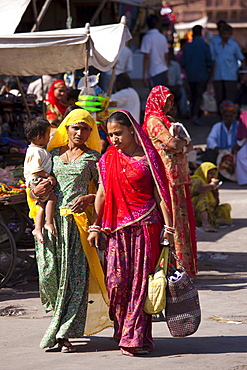 Indian women shopping, street scene at Sardar Market at Girdikot, Jodhpur, Rajasthan, Northern India