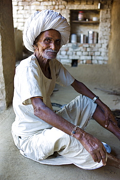 Indian man at home in Narlai village in Rajasthan, Northern India