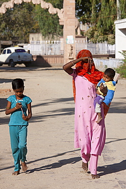 Young Indian woman with her children in Narlai village in Rajasthan, Northern India