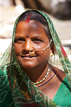 Indian woman with traditional nose jewel in old town Udaipur, Rajasthan, Western India