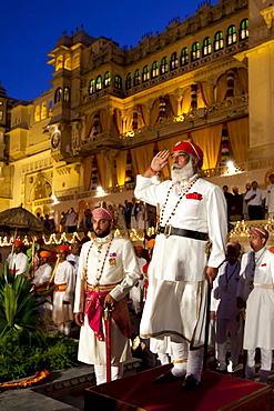 Shriji Arvind Singh Mewar of Udaipur, 76th Custodian of the House of Mewar, presides at annual Hindu Holi Fire Festival at The Zenana Mahal in the City Palace, Udaipur, Rajasthan, India. On his right is son  Lakshyaraj Singh Mewar of Udaipur, Maharaj Kumar.