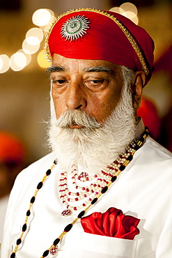 Shriji Arvind Singh Mewar of Udaipur, 76th Custodian of the House of Mewar, presides at annual Hindu Holi Fire Festival at The Zenana Mahal in the City Palace, Udaipur, Rajasthan, India