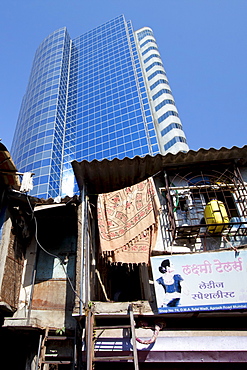 Essar House office development for Essar Group by slums in Mahalaxmi area of Mumbai, India shows contrast of rich and poor