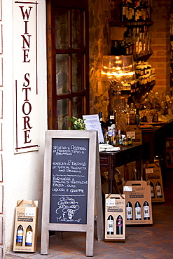 Grotta del Brunello wine shop in Costa di Piazza Garibaldi in old hill town of Montalcino, Val D'Orcia, Tuscany, Italy