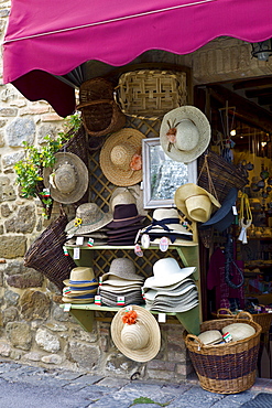 Hats and souvenirs in shop in Montalcino, Val D'Orcia,Tuscany, Italy